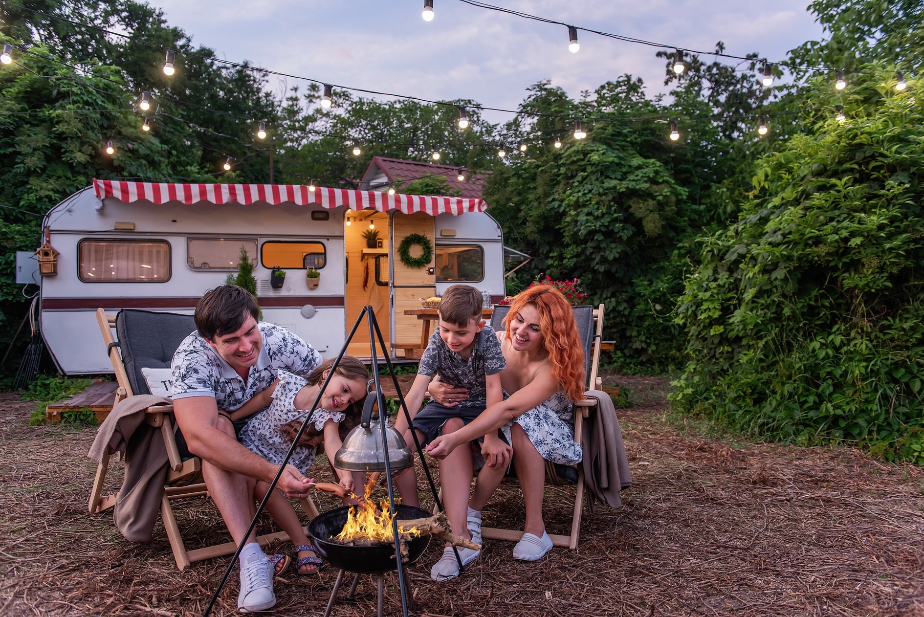 Family Having Picnic Outdoors with RV